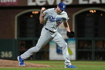 (FILES) In this file photo taken on October 13, 2021 Max Scherzer #31 of the Los Angeles Dodgers celebrates after beating the San Francisco Giants 2-1 in game 5 of the National League Division Series at Oracle Park in San Francisco, California. -