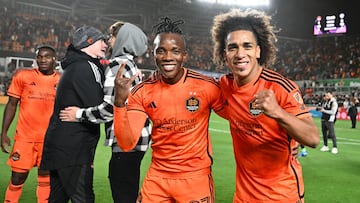 Nov 26, 2023; Houston, Texas, USA; Houston Dynamo midfielder Luis Caicedo (27) and midfielder Adalberto Carrasquilla (20) react after defeating the Sporting Kansas City for the MLS Cup Western Conference Semifinal match at Shell Energy Stadium. Mandatory Credit: Maria Lysaker-USA TODAY Sports